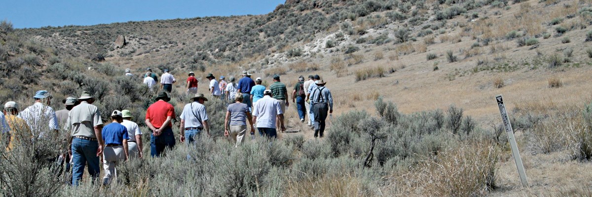 A group of people hiking along the California Trail.