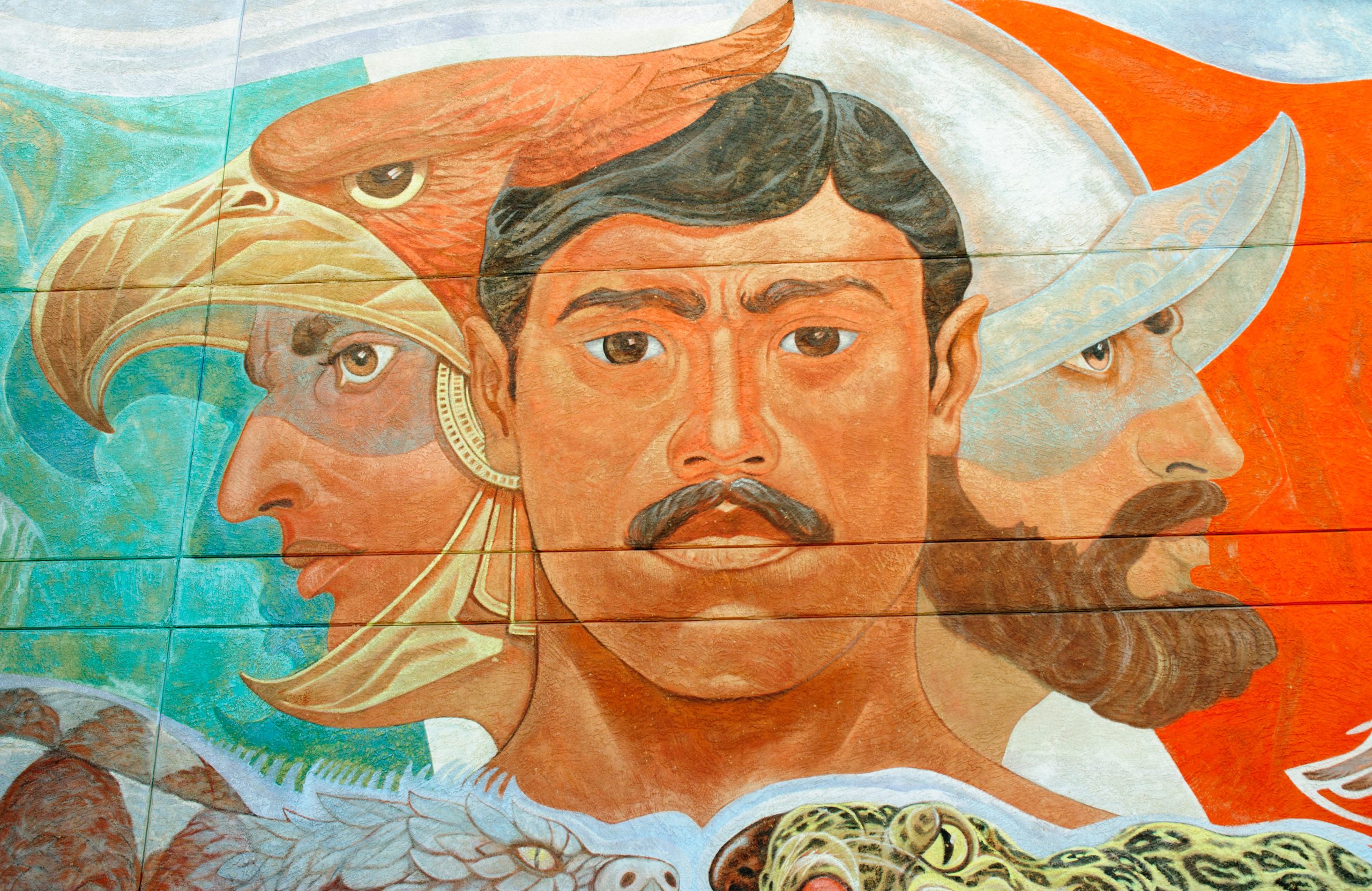 A colorful mural depicting some of the diverse people, history, and heritage of the United States and Mexico.